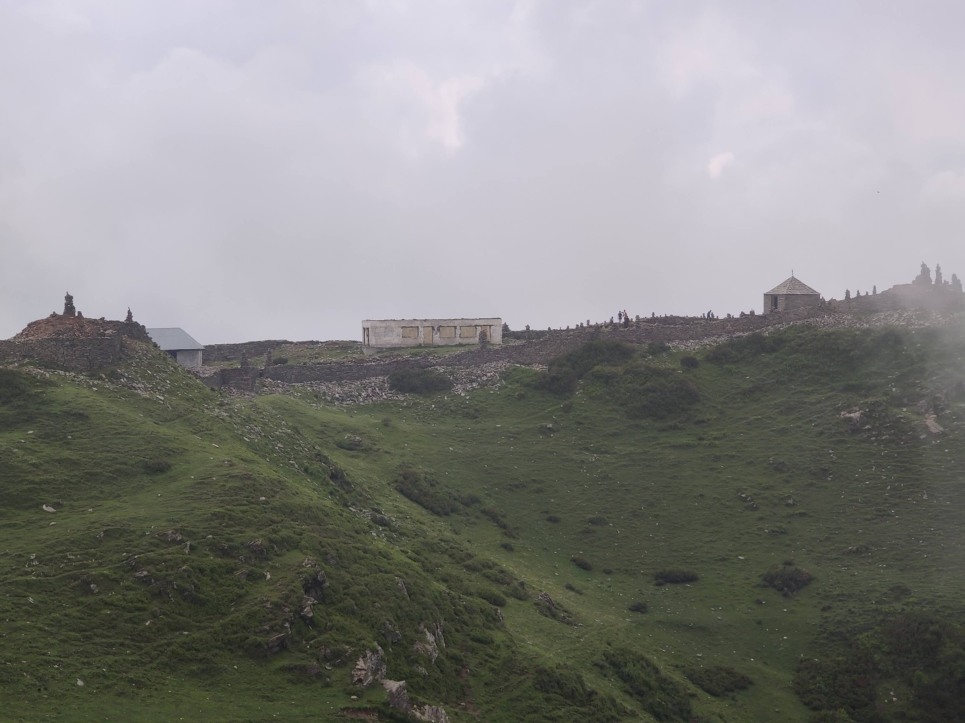 Trekker navigating the historic trail to Raghupur Fort in Jibhi