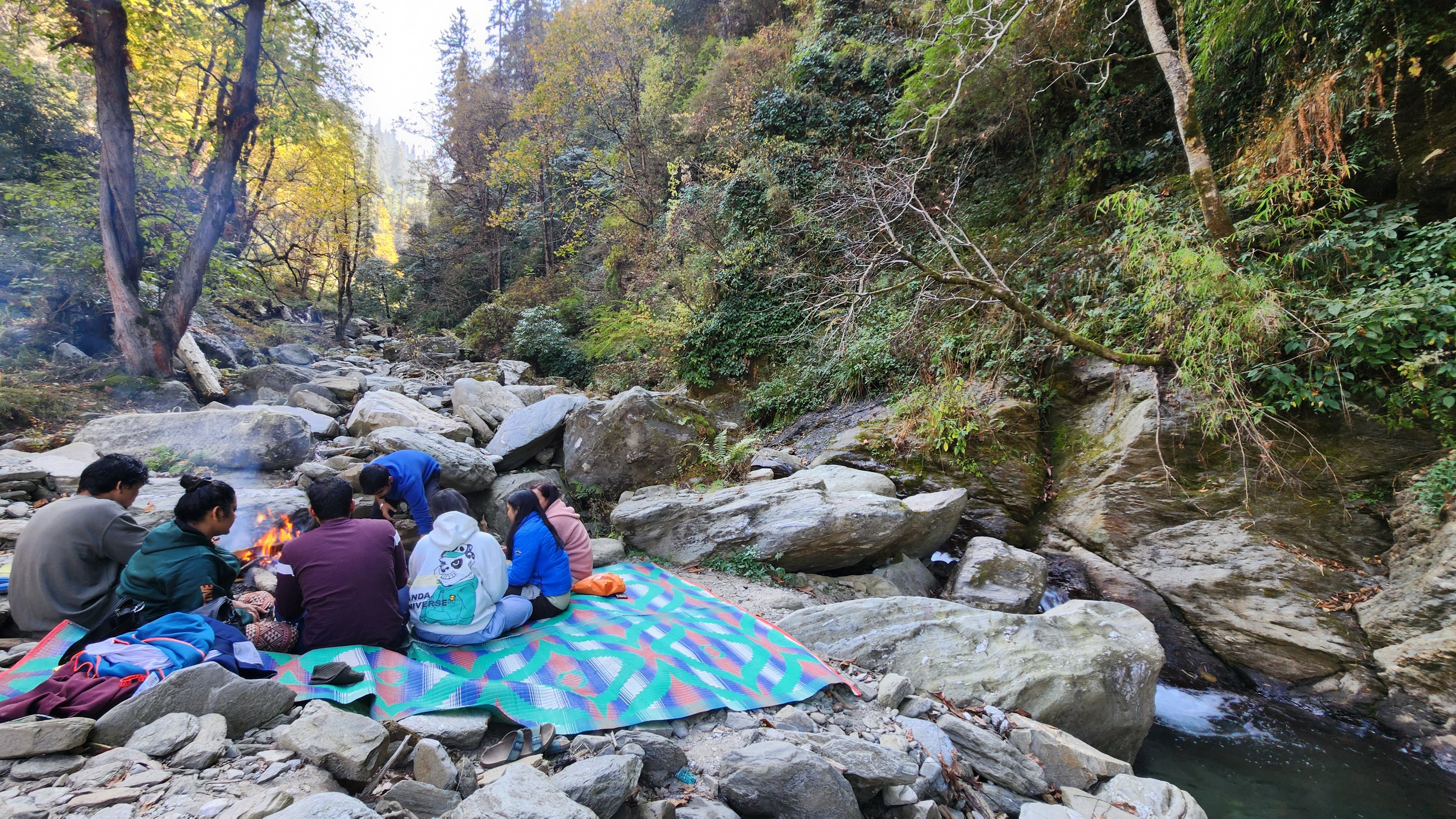 Picnic setup with cushions and local food